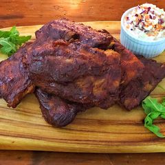 A picture of Oven baked baby back ribs with dry rub and Bourbon BBQ sauce.