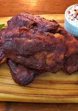 A picture of Oven baked baby back ribs with dry rub and Bourbon BBQ sauce.