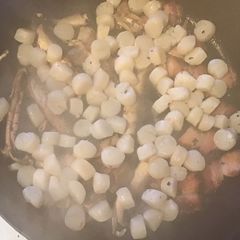 A picture of California Farm Scallops with Bacon and Mushrooms.