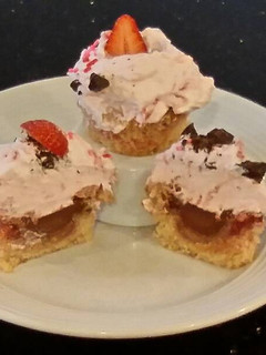 A picture of Fresh Strawberry Chocolate Truffle Cupcakes with Fresh Strawberry Whipped Cream Frosting.