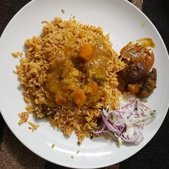 A picture of Vegetable biryani with brinjal thokku.
