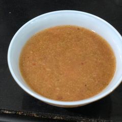 A picture of Broccoli and Tomato soup.