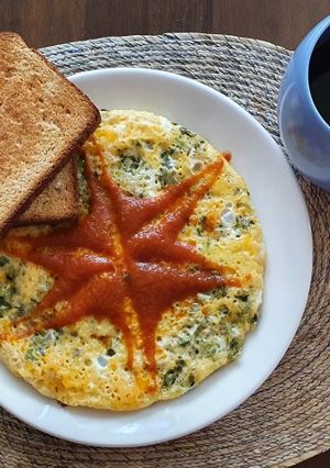 A picture of Egg Omelette with Green Onions.