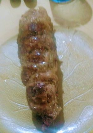 Una foto de Asado a la parrilla de solomillo chancho mechado ají-ajo