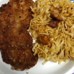 A picture of Pork and Pasta with Cheese.