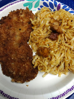 A picture of Pork and Pasta with Cheese.
