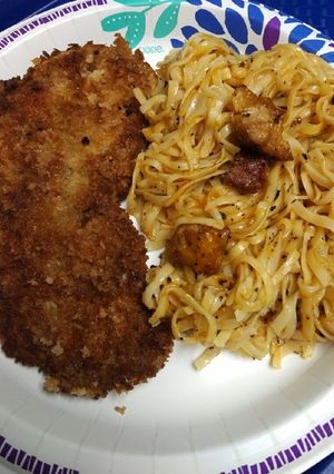 A picture of Pork and Pasta with Cheese.
