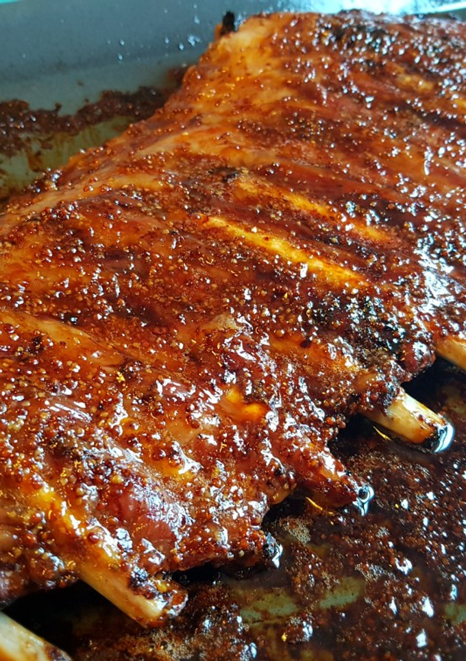 Una foto de Costillas al horno con mostaza antigua y miel de romero.👌
