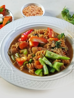 A picture of Chickpea pasta with red Lentil and Colorful Vegetables.