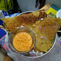A picture of Moong dal chilla with coconut chutney.