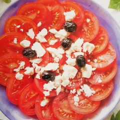 A picture of Tomato and feta cheese salad.