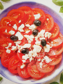 A picture of Tomato and feta cheese salad.