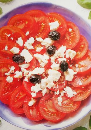 A picture of Tomato and feta cheese salad.