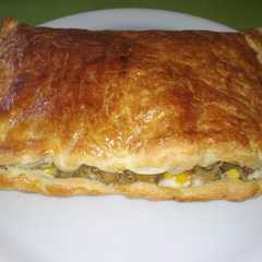 Una foto de Empanada de champiñones, maíz y gorgonzola