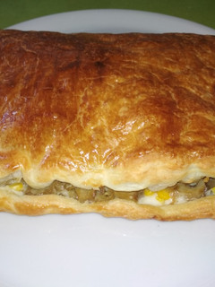 Una foto de Empanada de champiñones, maíz y gorgonzola