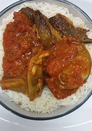 A picture of Rice with tomato stew.