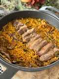 Arroz de secreto ibérico con boletus y alcachofas
