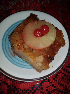 Una foto de Budín de pan con piña, duraznos y almendras