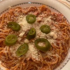 A picture of Spaghetti in red sauce.