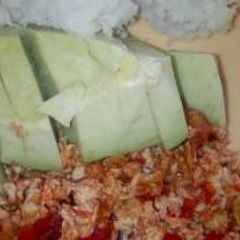 A picture of Scrambled eggs, ovacado and ugali.
