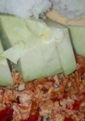 A picture of Scrambled eggs, ovacado and ugali.