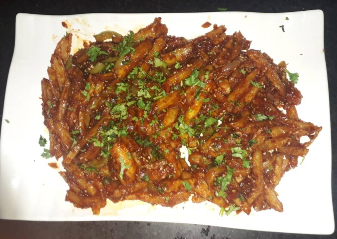French fries with honey, sesame and chili