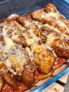 Una foto de Fingers de pollo al horno con mozzarella y parmesano