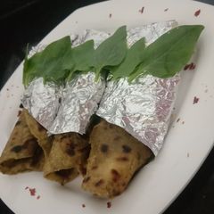 A picture of Palak Aloo Paratha.