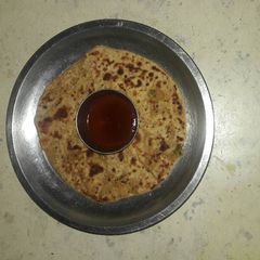 A picture of Radish, cucumber, paneer stuffed paratha.