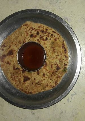 A picture of Radish, cucumber, paneer stuffed paratha.