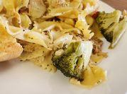 A picture of basil penne with cherry tomato