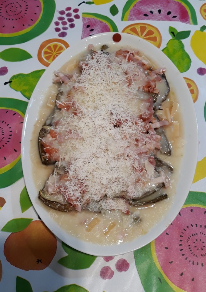 Una foto de Alcachofas confitadas con bacon y crema de arroz al gratén