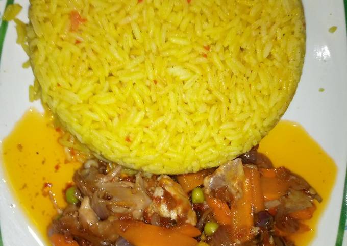 Yellow jollof rice with chicken beast sauce