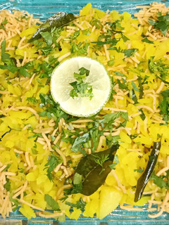 A picture of Kanda, Batata Poha with Aloo Bhujia Sev.