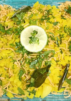 A picture of Kanda, Batata Poha with Aloo Bhujia Sev.