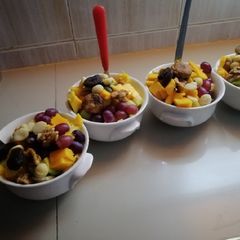 A picture of #endyearchallenge mixed fruit salaad different nuts.