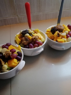 A picture of #endyearchallenge mixed fruit salaad different nuts.