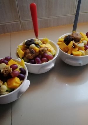 A picture of #endyearchallenge mixed fruit salaad different nuts.