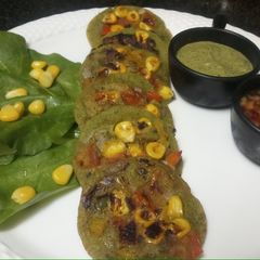 A picture of Spinach Rava Corn Pancakes.