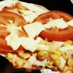 Una foto de Pizza con Maíz