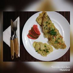 Breakfast Omelette with a side of spiced baked potatoes A picture of Breakfast Omelette with a side of spiced baked potatoes.