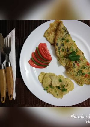 A picture of Breakfast Omelette with a side of spiced baked potatoes.