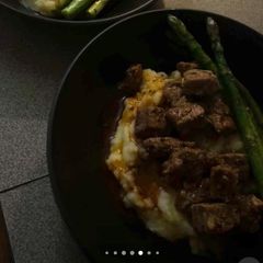 A picture of Garlic Butter Steak Bites, Mash & Greens.