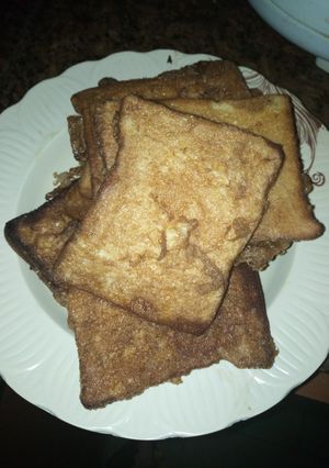 A picture of Bread into egg.