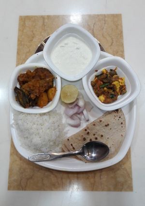 A picture of Sindhi seyal bhaji,mushroom paneer,roti rice & salad.