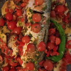 A picture of Moroccan Oven-Baked Fish with Potatoes & Cherry Tomatoes.