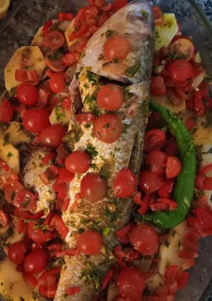 A picture of Moroccan Oven-Baked Fish with Potatoes & Cherry Tomatoes.