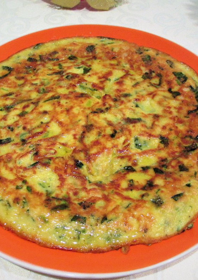 Una foto de Tortilla de alubias blancas y espinaca fresca