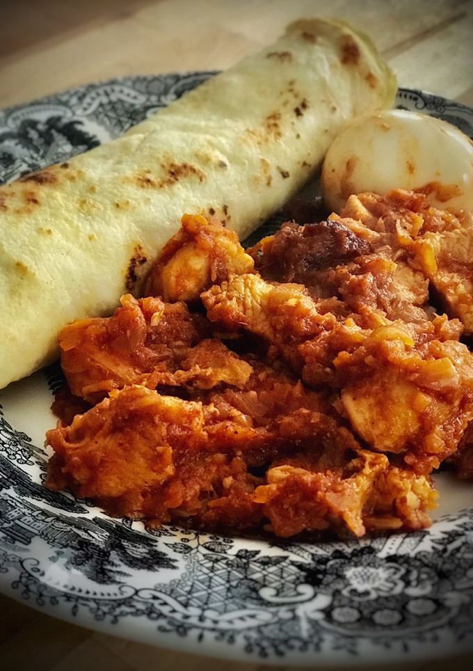 Una foto de Cena etíope: Doro Wat con Injera