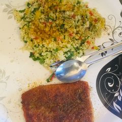 A picture of Couscous salad and Pan fried Salmon.
